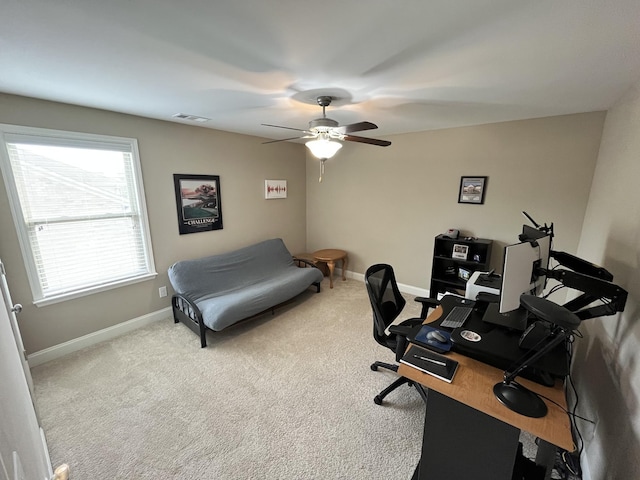 office space with carpet flooring, a wealth of natural light, and ceiling fan