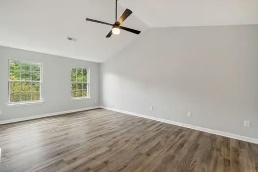 unfurnished room with ceiling fan, wood-type flooring, and vaulted ceiling