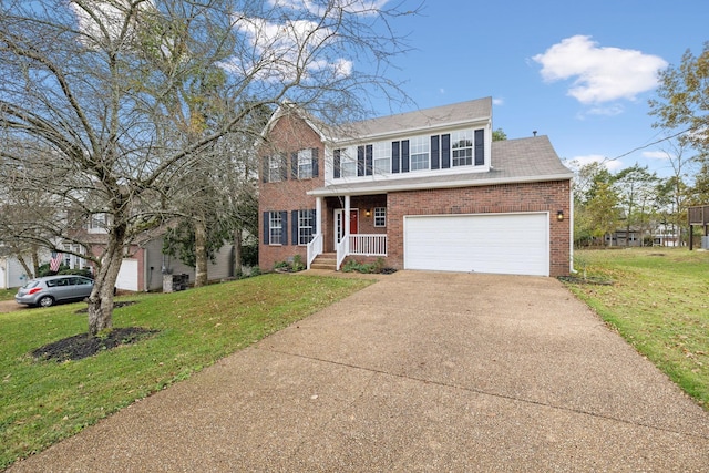 colonial house with a garage and a front yard