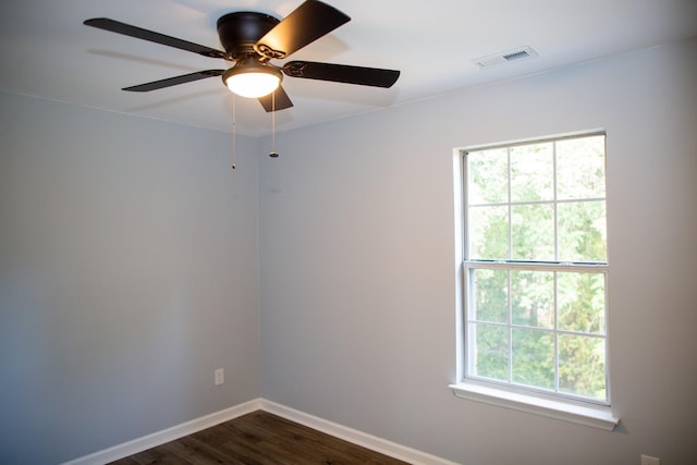 unfurnished room featuring dark hardwood / wood-style flooring