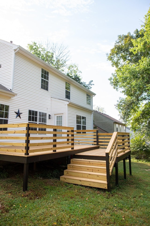 back of house featuring a wooden deck