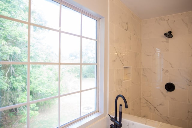 bathroom with tiled shower