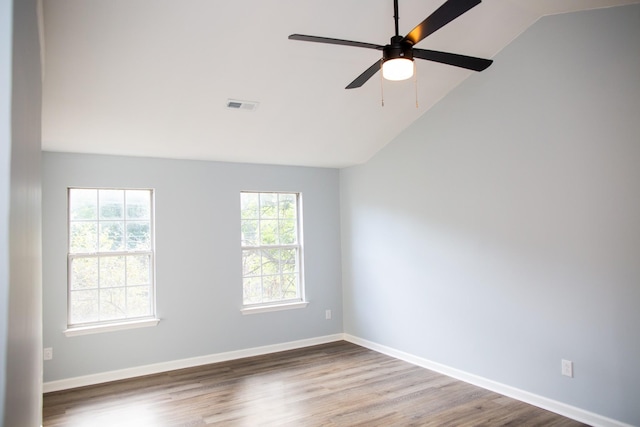 unfurnished room featuring ceiling fan, wood-type flooring, and vaulted ceiling