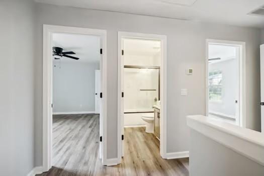 corridor featuring light hardwood / wood-style flooring