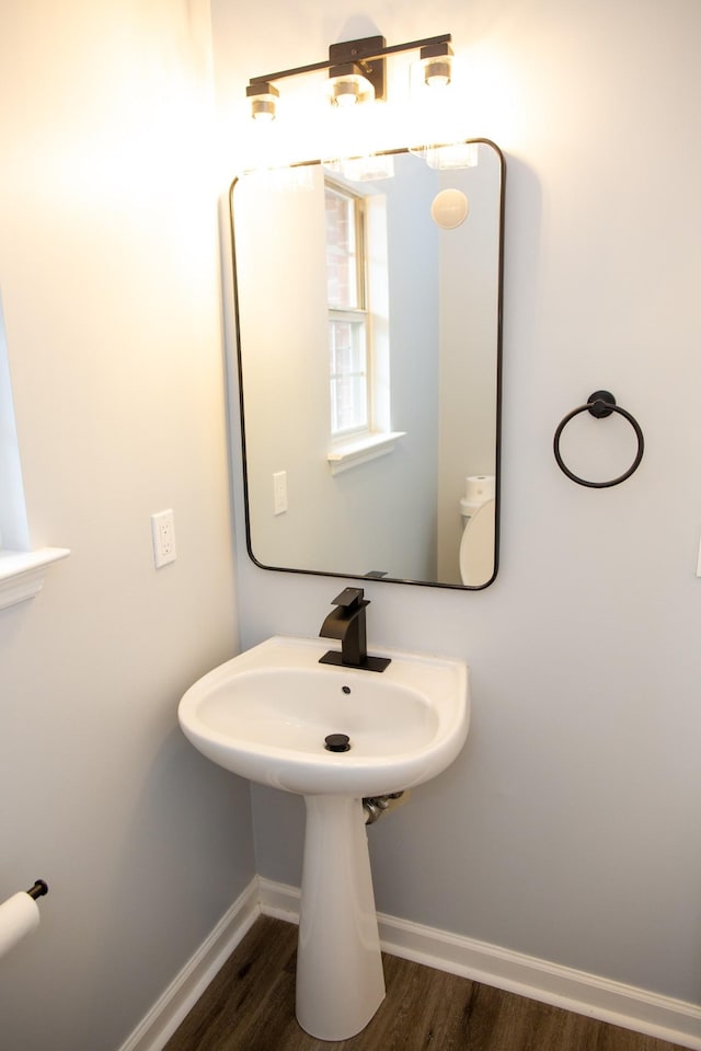 bathroom with sink and hardwood / wood-style floors