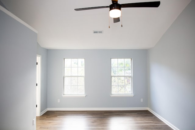 spare room featuring ceiling fan and wood-type flooring