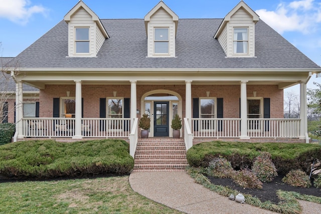 cape cod-style house with a porch