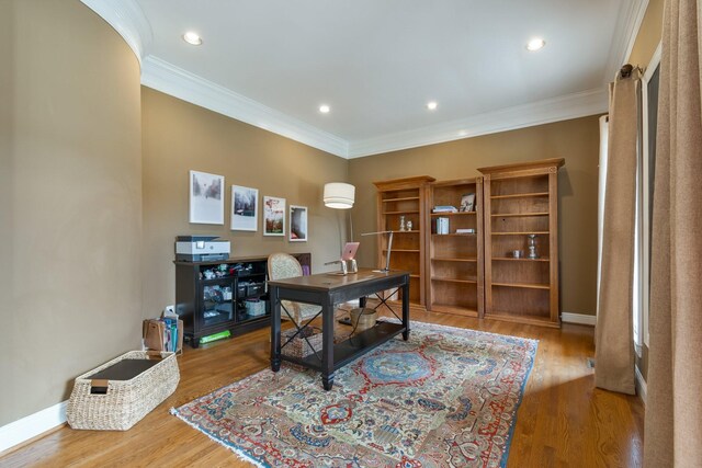 office featuring hardwood / wood-style flooring and ornamental molding