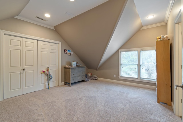 additional living space featuring lofted ceiling and light colored carpet