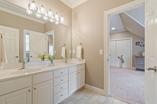 bathroom with ornamental molding and vanity