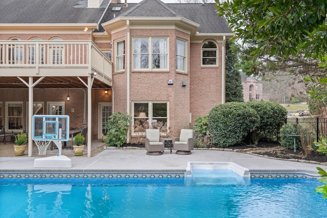 view of swimming pool with a patio