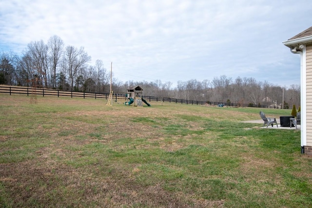 view of yard with a rural view and a playground