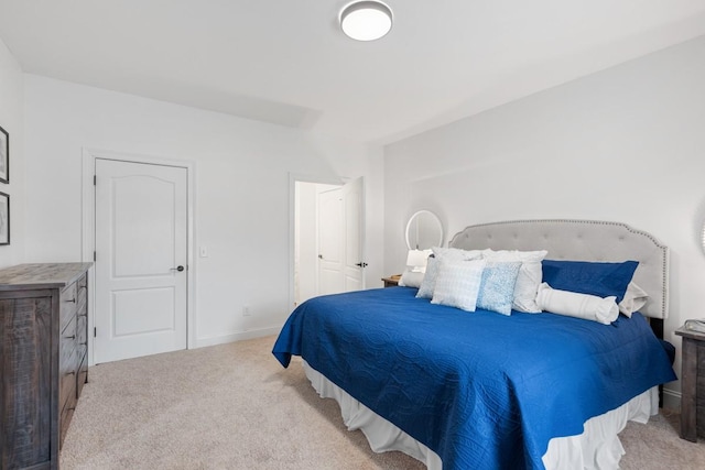 bedroom with light colored carpet