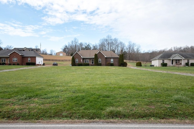 ranch-style home with a front yard