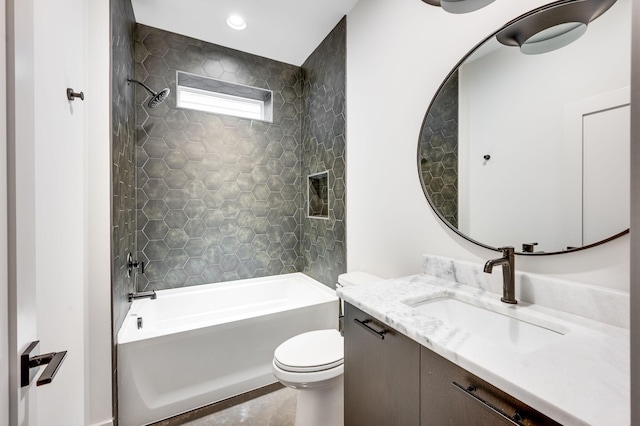 full bathroom with vanity, toilet, and tiled shower / bath combo