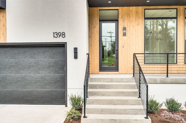 view of exterior entry with a garage