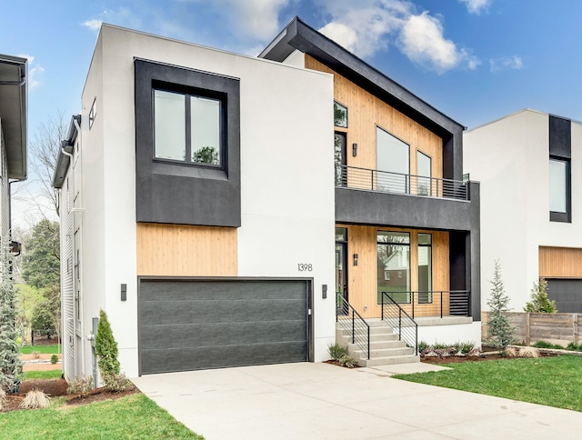 modern home with a balcony and a garage