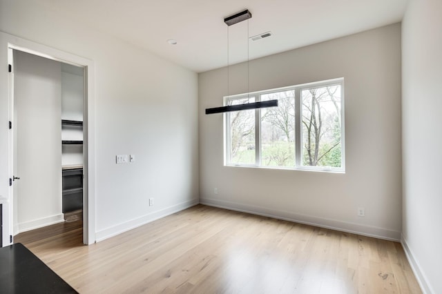 unfurnished dining area featuring light hardwood / wood-style flooring