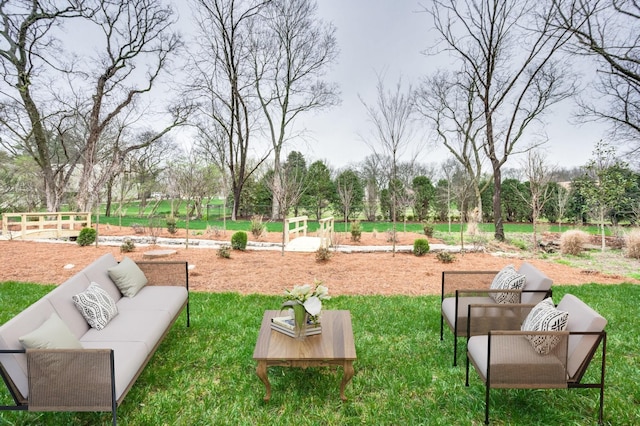 exterior space with a lawn and an outdoor living space