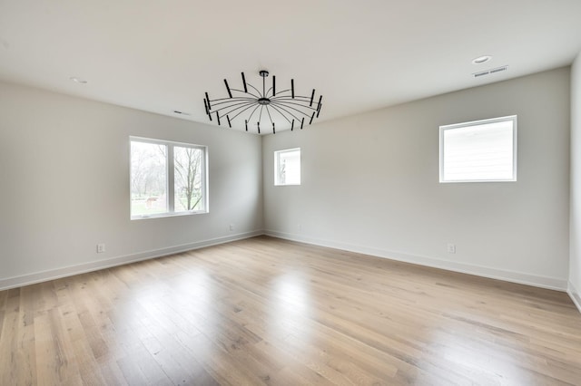 spare room featuring light wood-type flooring