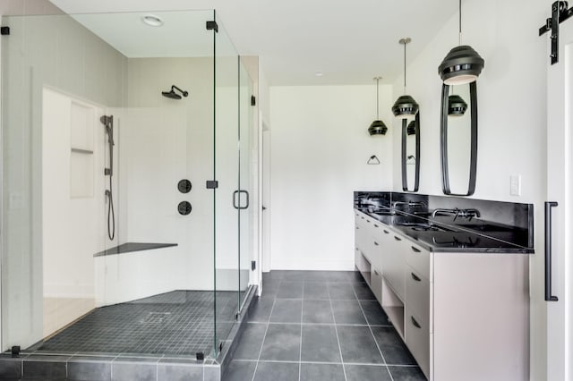 bathroom with vanity, tile patterned floors, and a shower with shower door