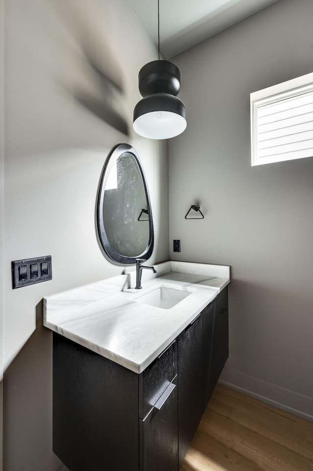 bathroom with vanity and hardwood / wood-style flooring