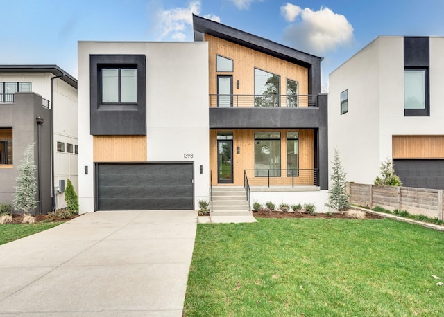 contemporary house with a garage, a balcony, and a front lawn