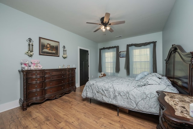 bedroom featuring ceiling fan and light hardwood / wood-style floors