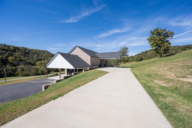 view of home's community featuring a lawn