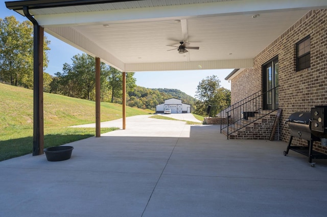 view of patio / terrace with area for grilling and ceiling fan