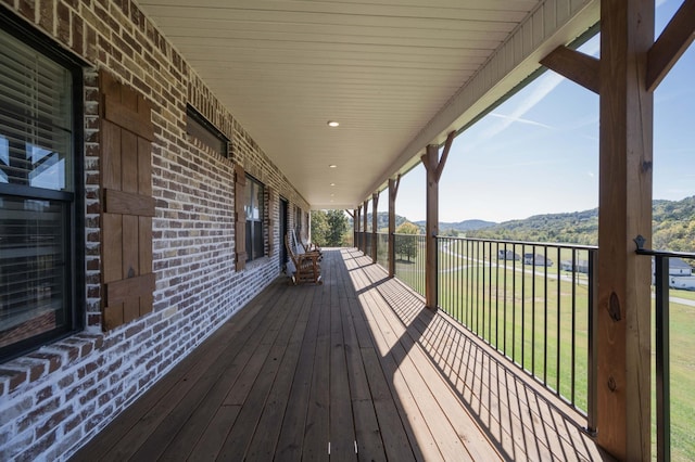 wooden deck featuring a mountain view