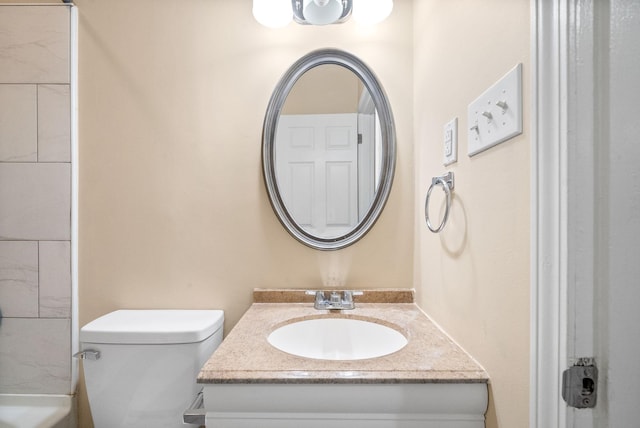 bathroom with vanity and toilet