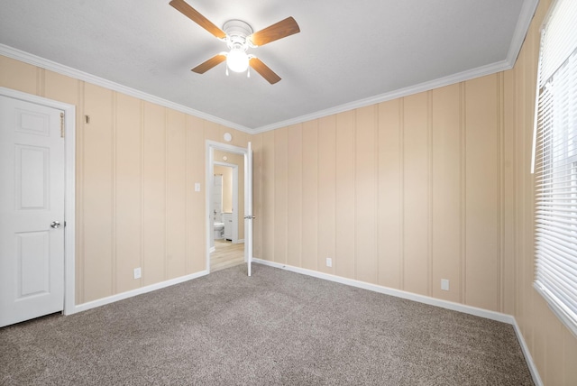 unfurnished bedroom with carpet, ceiling fan, and crown molding