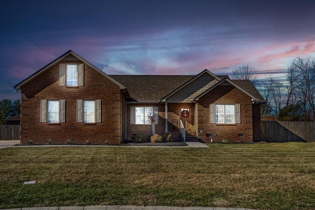 view of front of home with a yard