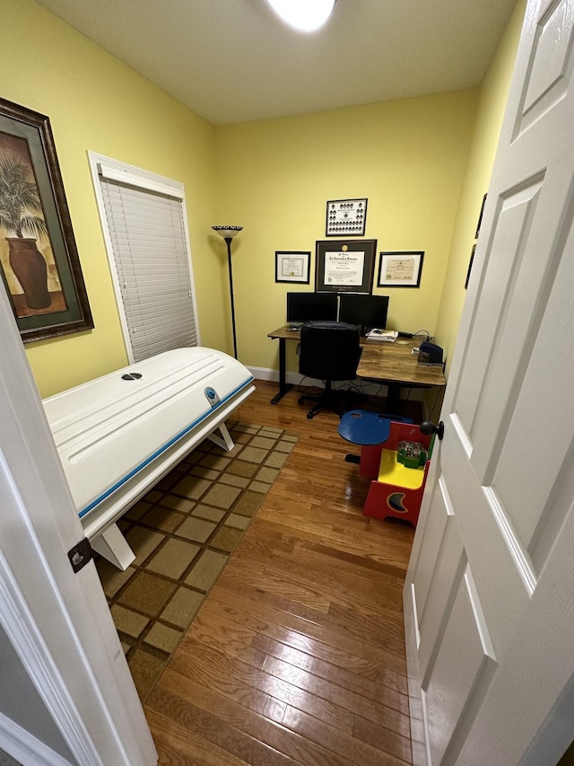 bedroom featuring dark hardwood / wood-style flooring