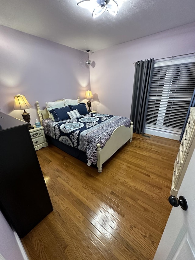 bedroom featuring wood-type flooring