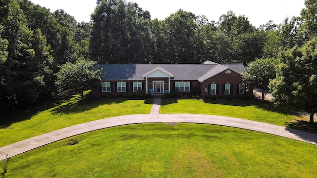 ranch-style home with a front yard