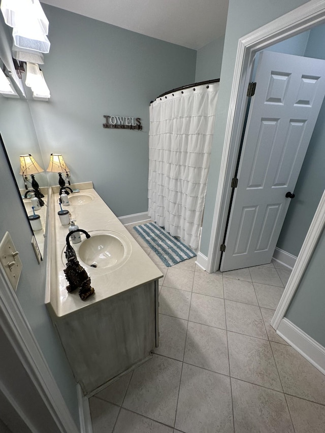 bathroom featuring curtained shower, tile patterned flooring, and vanity