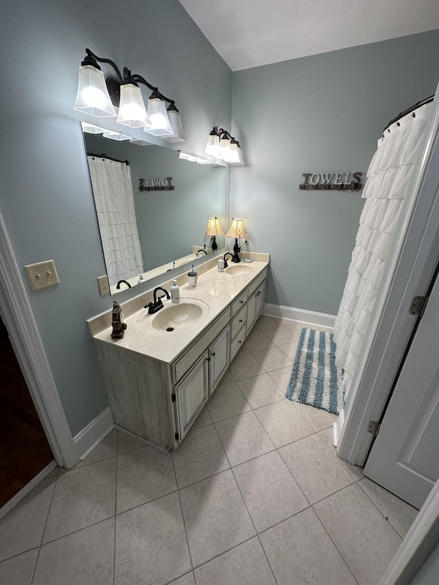 bathroom with tile patterned flooring and vanity