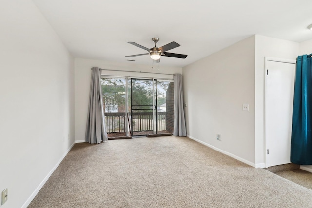 spare room with carpet and ceiling fan