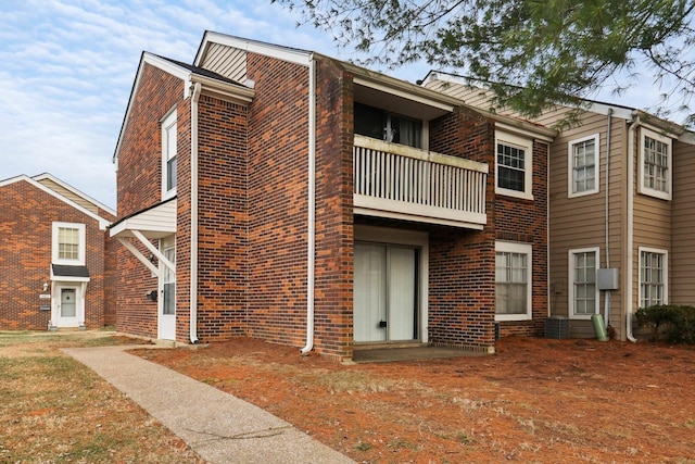 view of front of house featuring a balcony