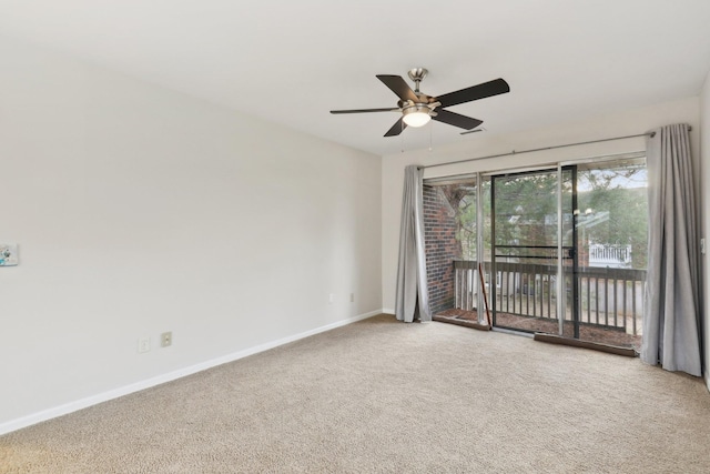 empty room featuring ceiling fan and carpet flooring