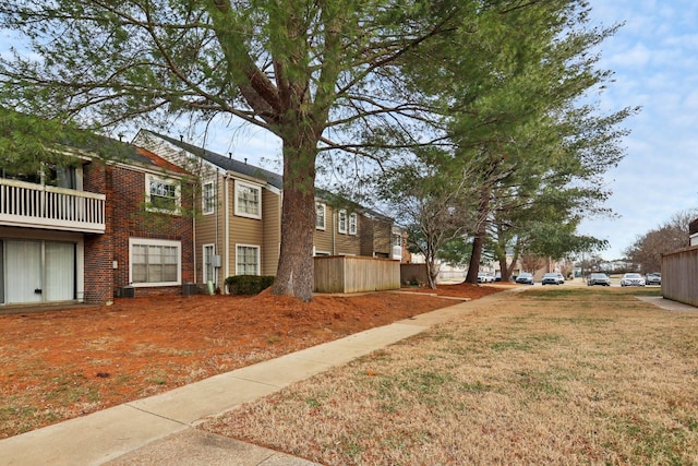 view of side of property featuring a lawn