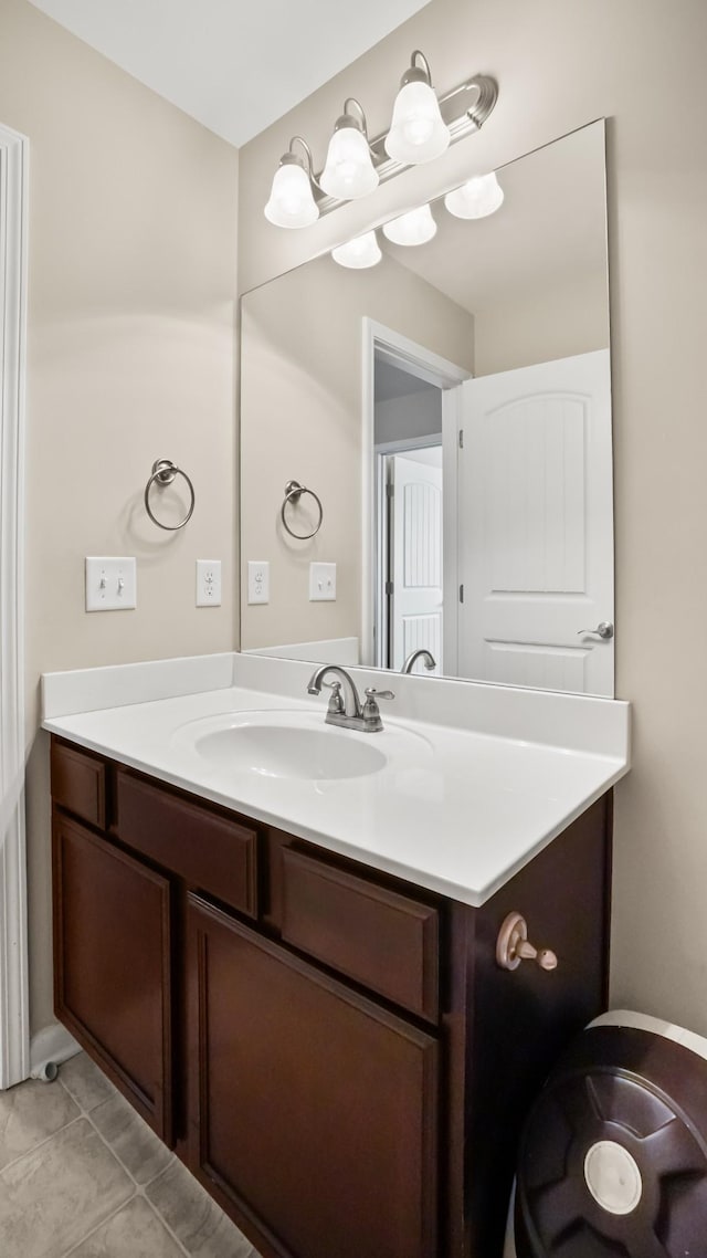 bathroom with tile patterned flooring and vanity