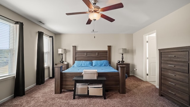 bedroom with carpet flooring, multiple windows, and ceiling fan