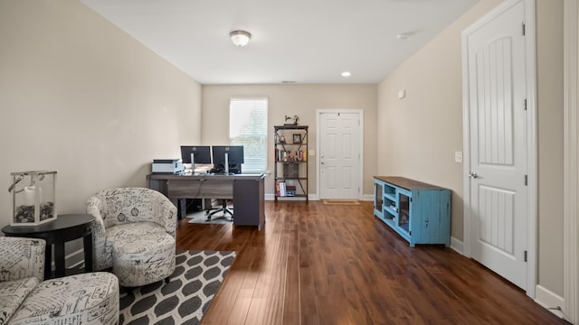 home office with dark hardwood / wood-style flooring