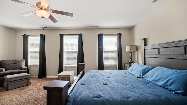 bedroom featuring light colored carpet and ceiling fan