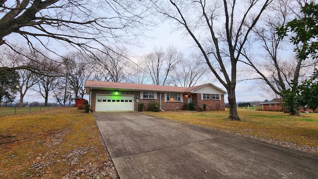 ranch-style house with a front lawn and a garage