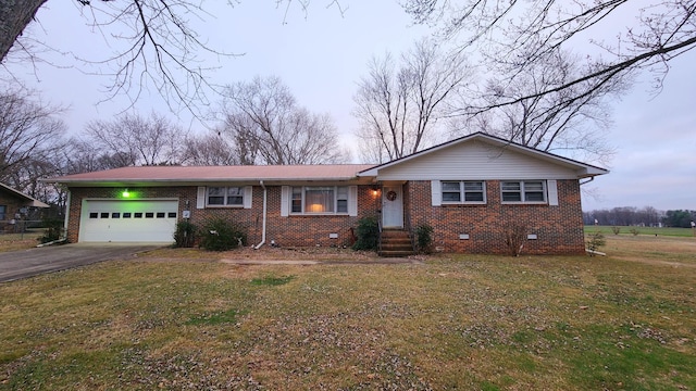 single story home with a garage and a front yard