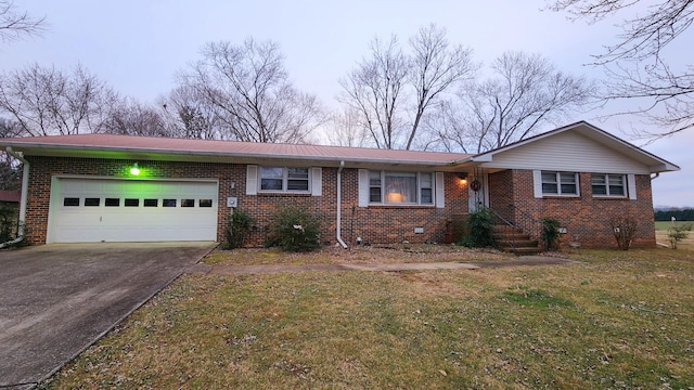 ranch-style house with a front yard and a garage